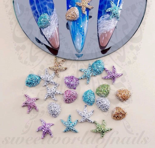 https://www.sweetworldofnails.com/cdn/shop/products/3d-glitter-summer-starfish-shell-nail-charms-decoration.jpg?v=1677146026